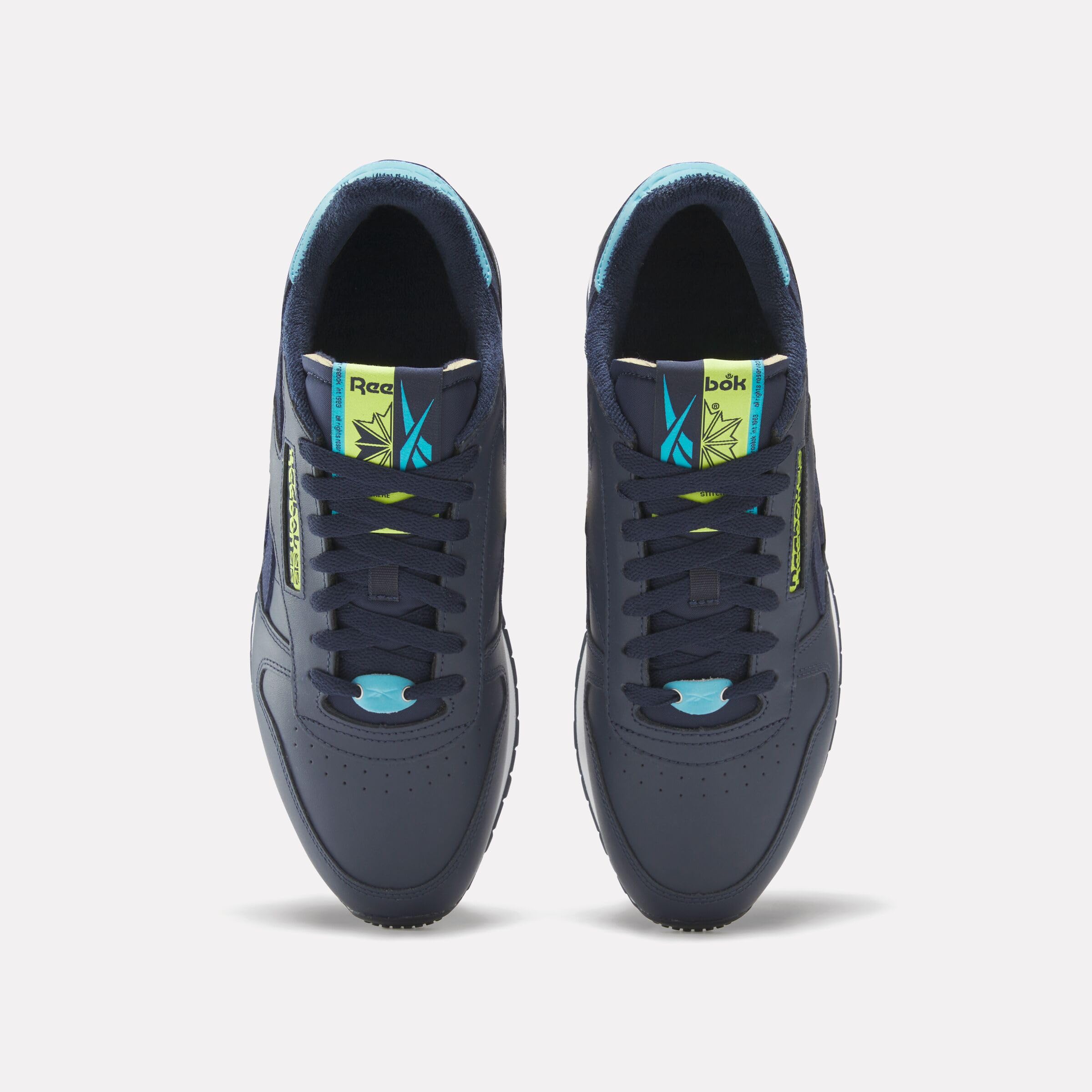 Reebok Unisex Classic Leather Sneaker, Vector Navy/Acid Yellow/Bold Cyan, Men Size's 11/ Women's Size 12.5